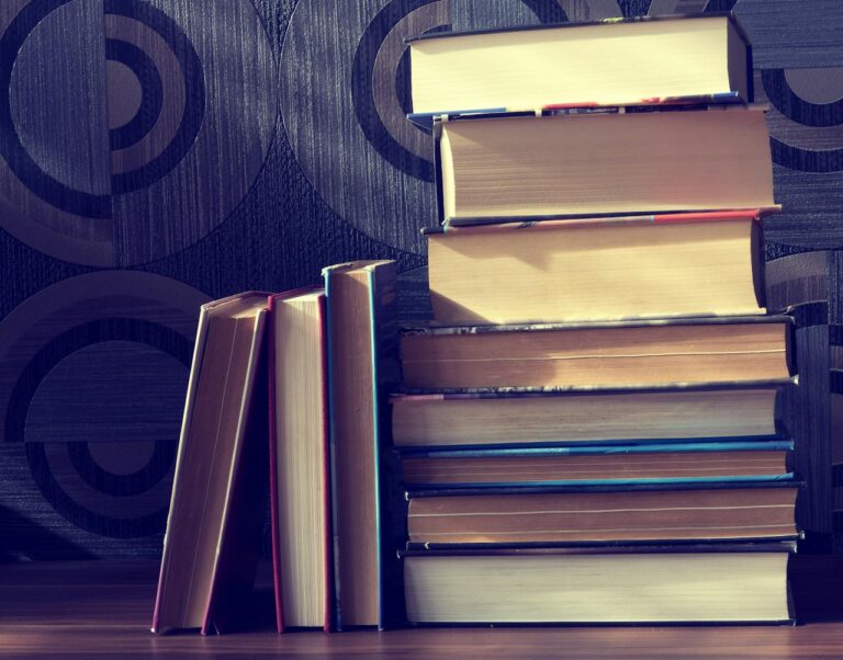 A pile of hardcover books with a vintage vibe, perfect for literature lovers.